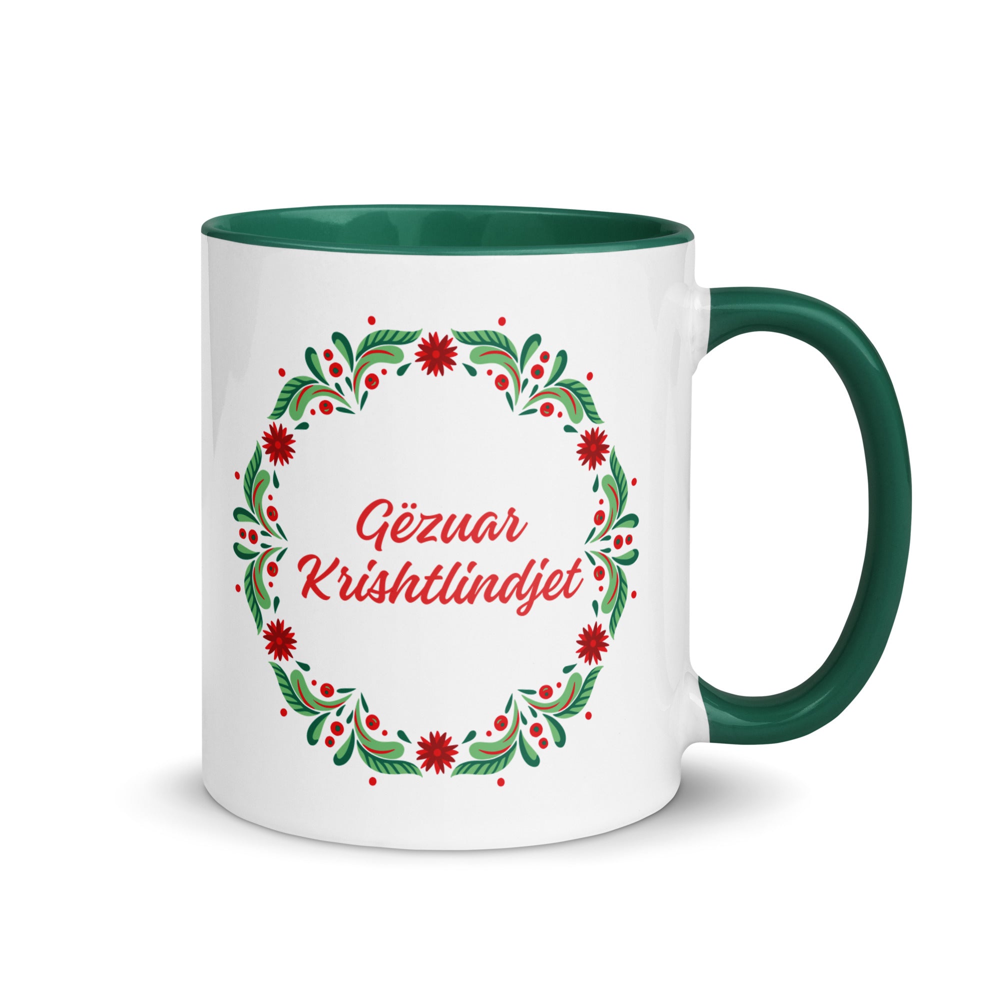 White mug with wreath and “Gëzuar Krishtlindjet” Albanian Christmas text.