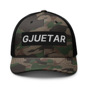 Albanian Gjuetar camouflage trucker hat with embroidered white lettering and black mesh back
