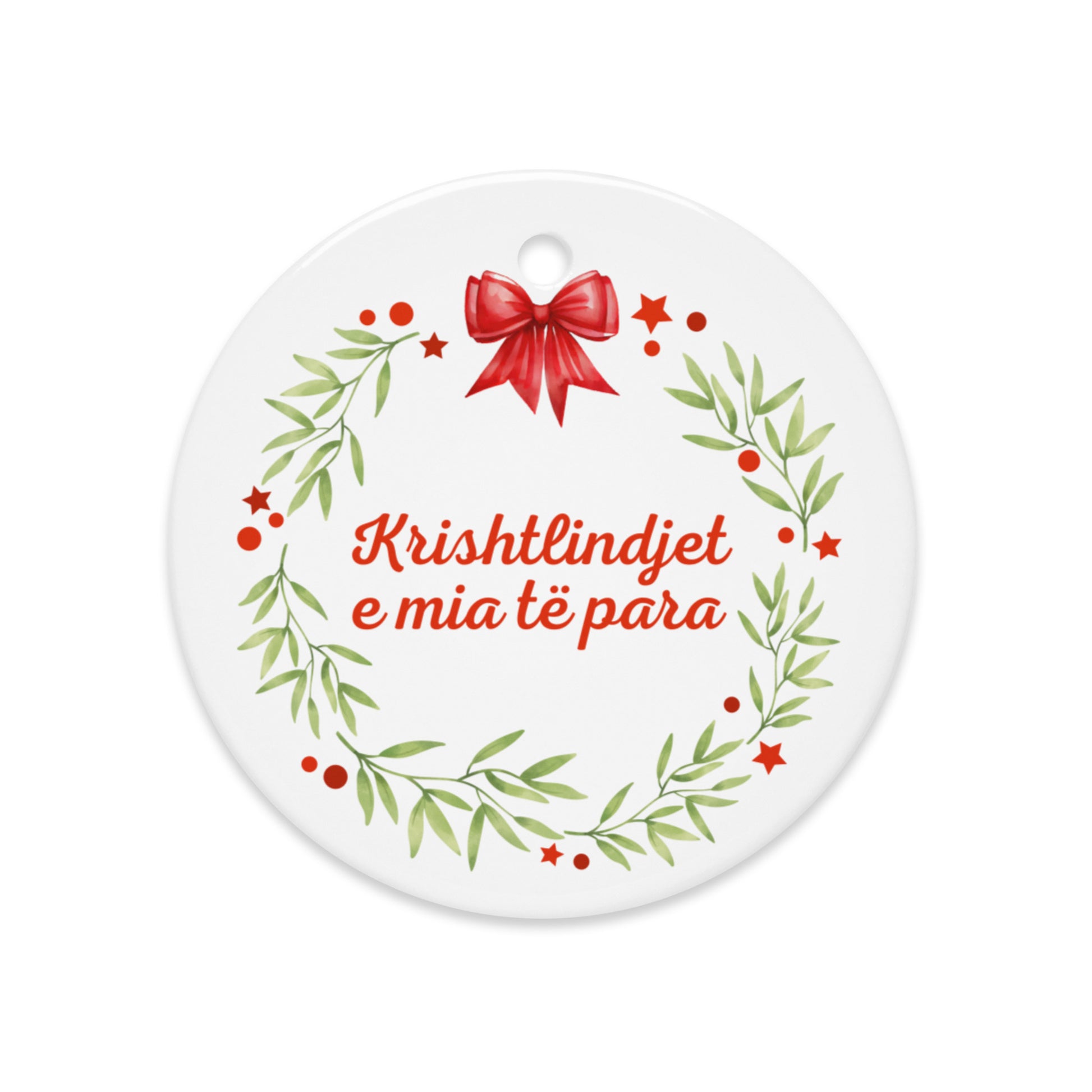 Albanian wreath ornament with red bow and “Krishtlindjet e mia të para”