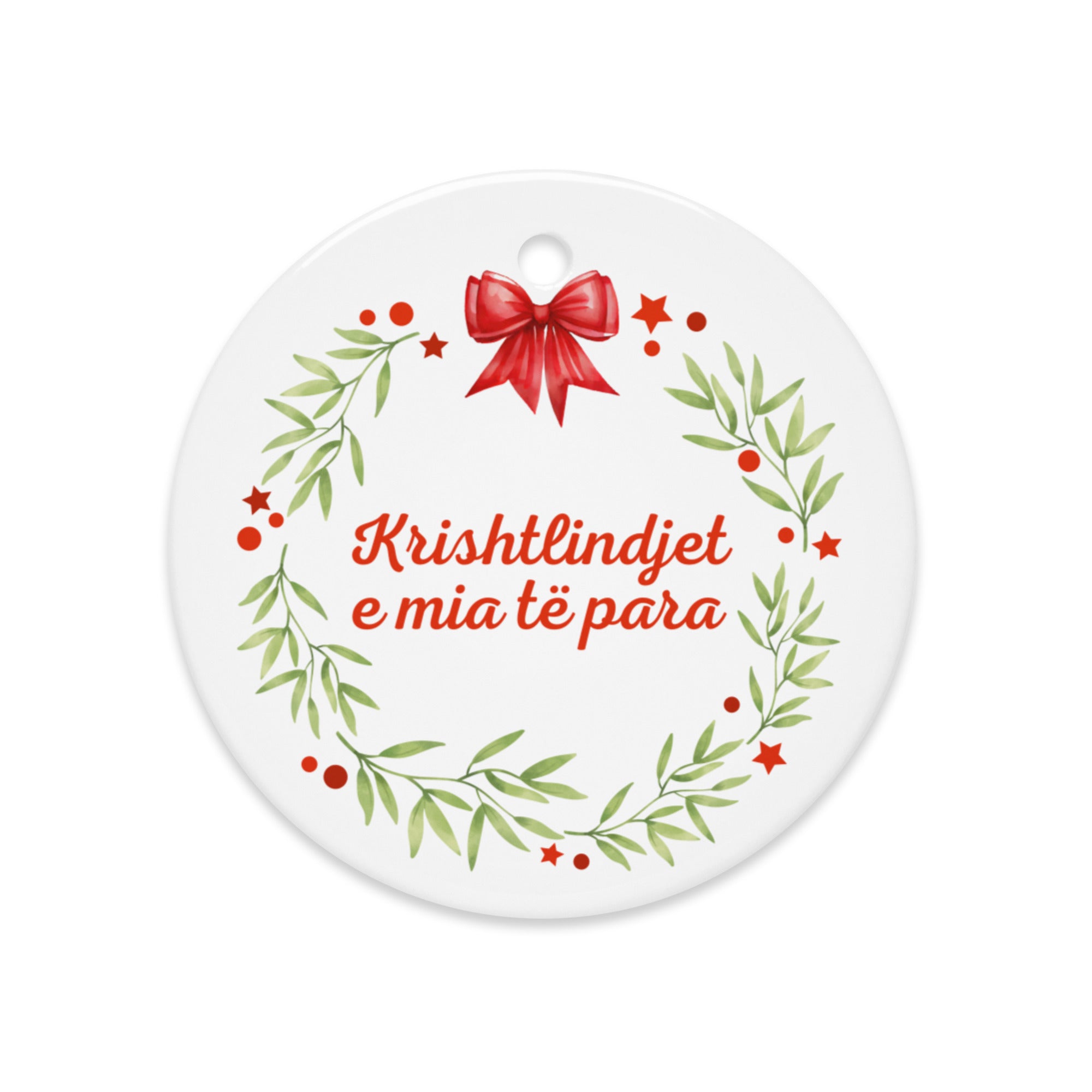 Albanian wreath ornament with red bow and “Krishtlindjet e mia të para”