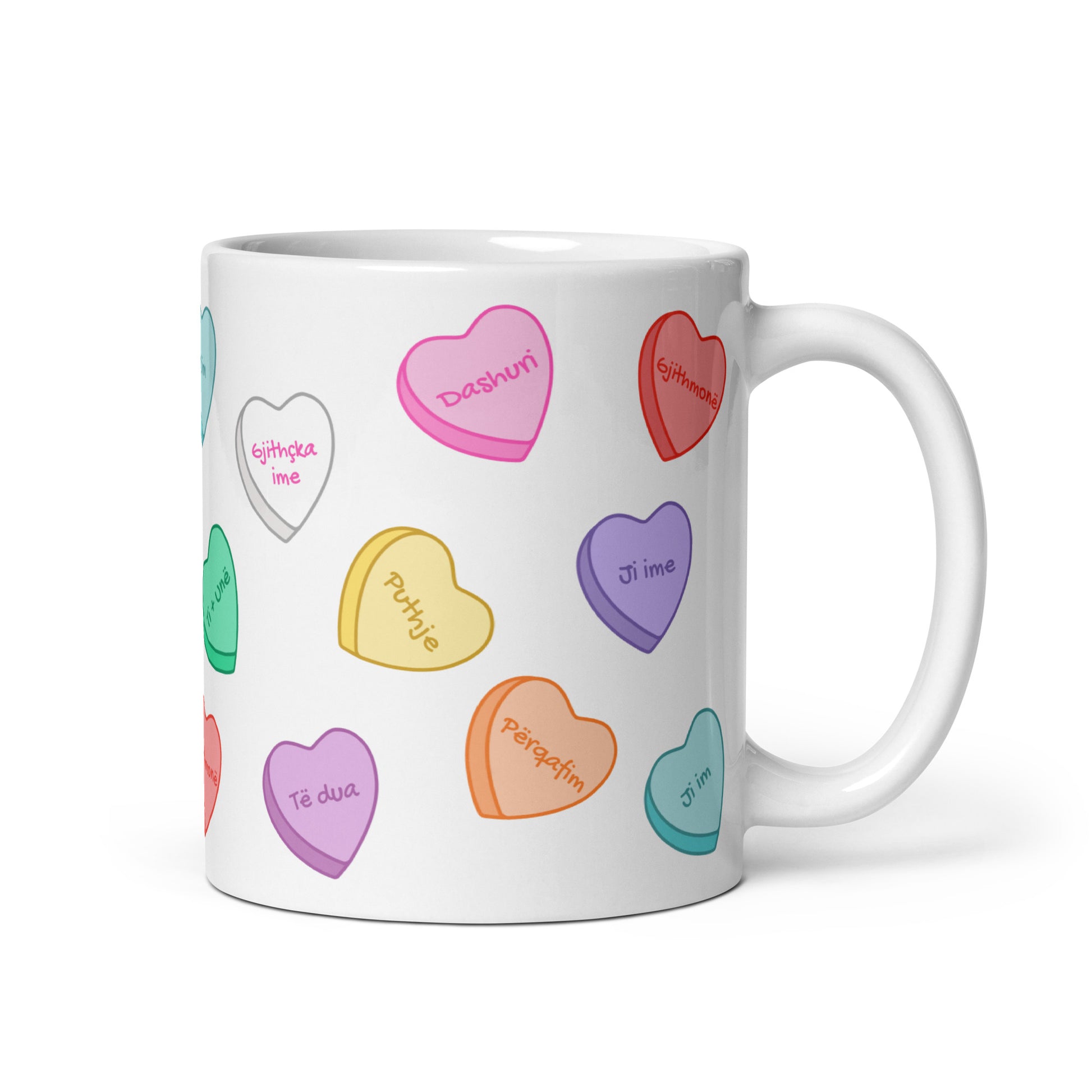 White mug with Sweethearts-style candy hearts and romantic phrases.