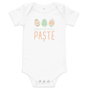 Romanian baby bodysuit with pastel Easter eggs and the phrase “Primul meu Paște” meaning My First Easter in Romanian