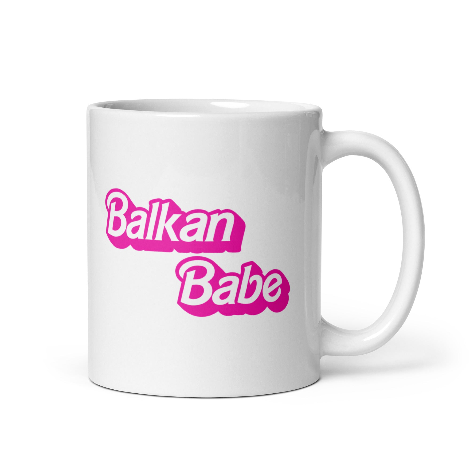 White mug with pink lettering that reads “Balkan Babe.”