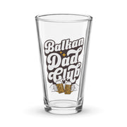 clear pint glass with retro balkan dad club design and clinking beer mugs graphic