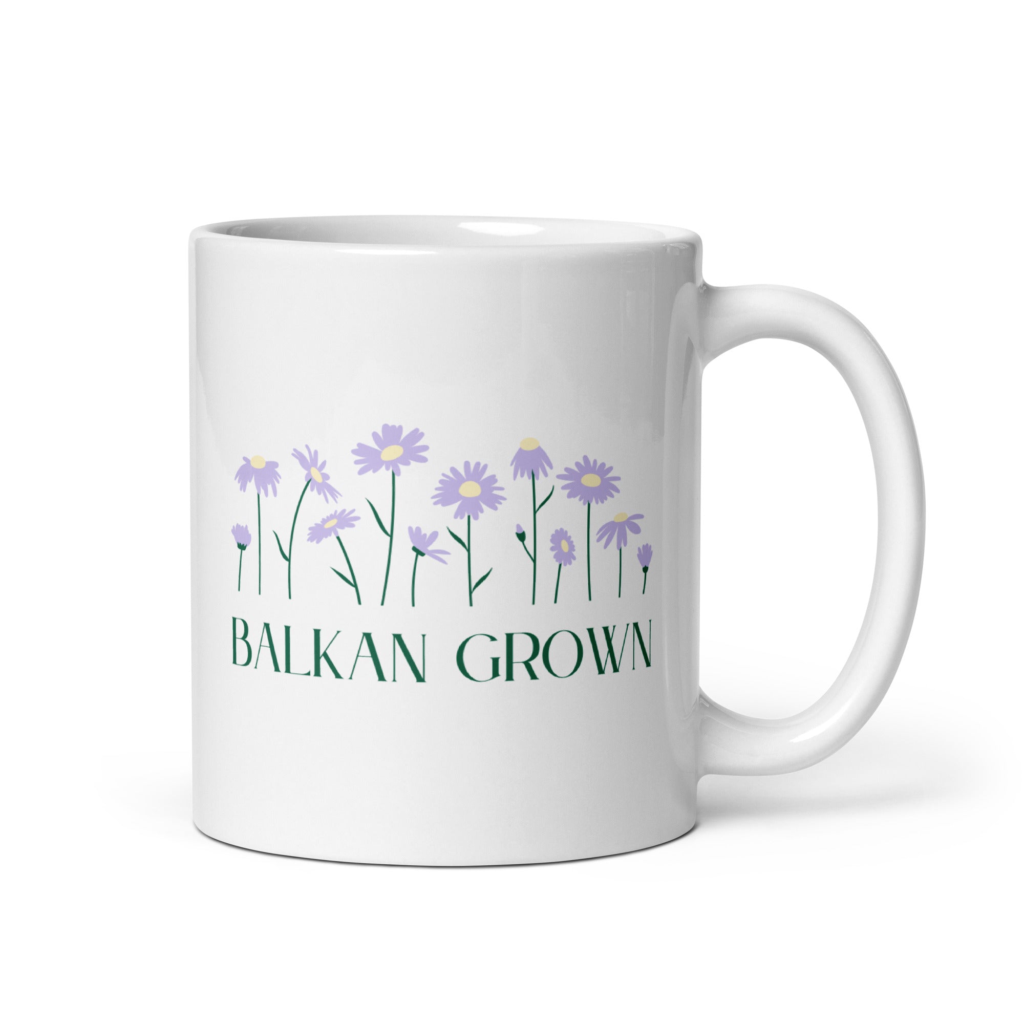 White mug with purple wildflowers and the phrase “Balkan Grown.”