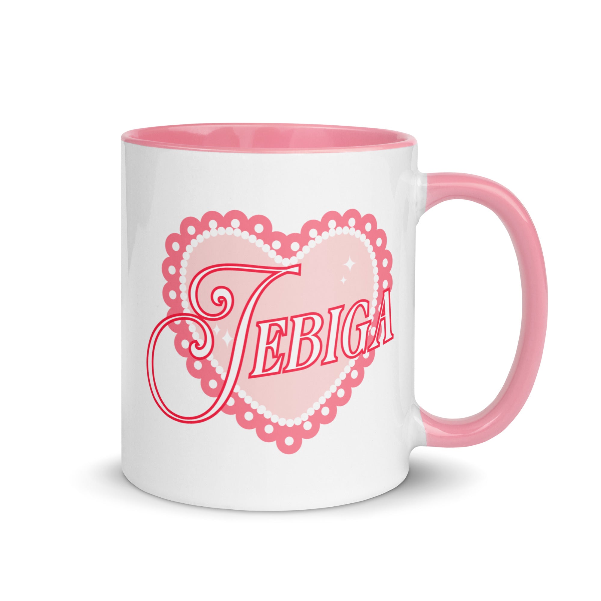 White mug with pink handle featuring the word “Jebiga” inside a pink lace heart.
