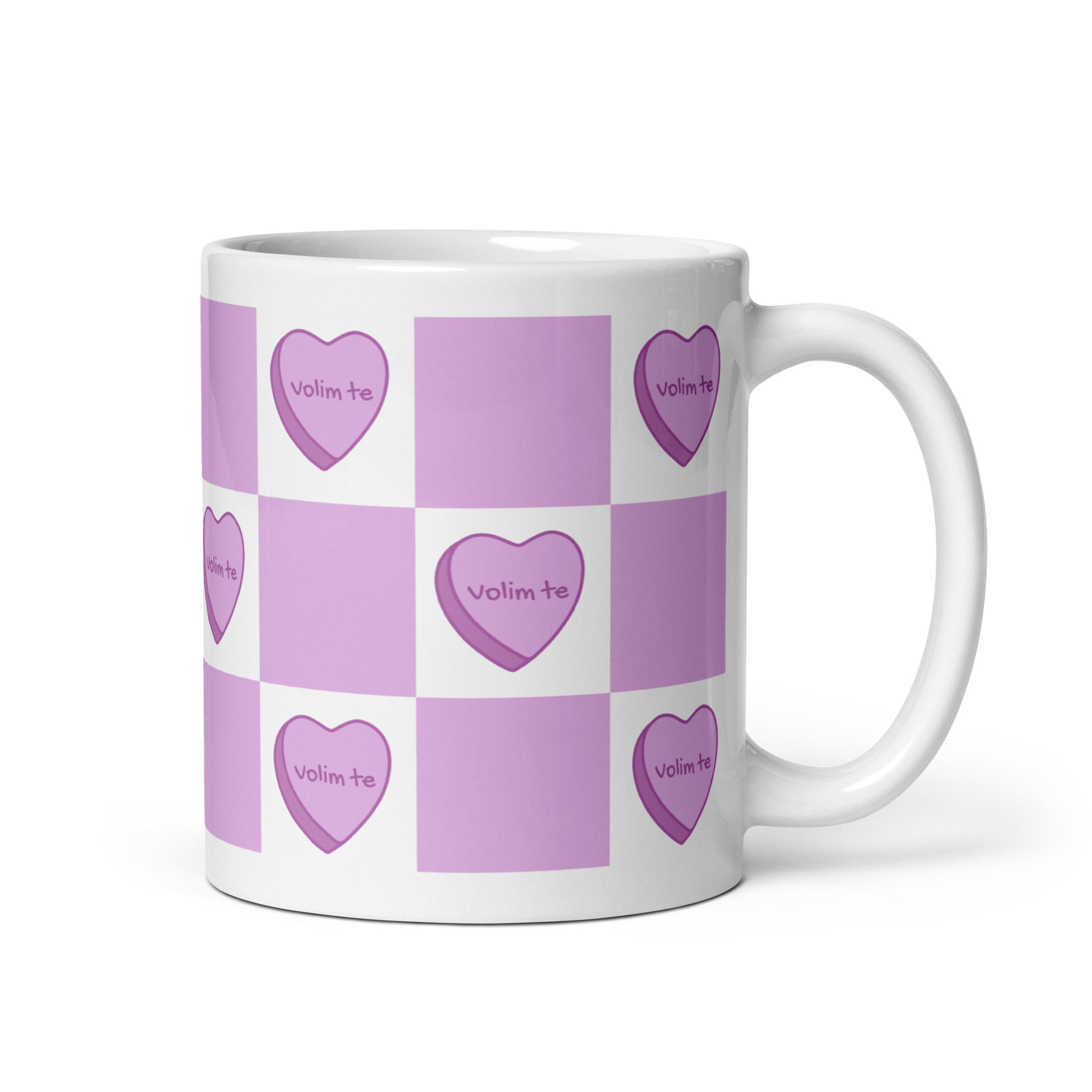 White mug with lavender checkered pattern and heart designs reading “Volim te.”