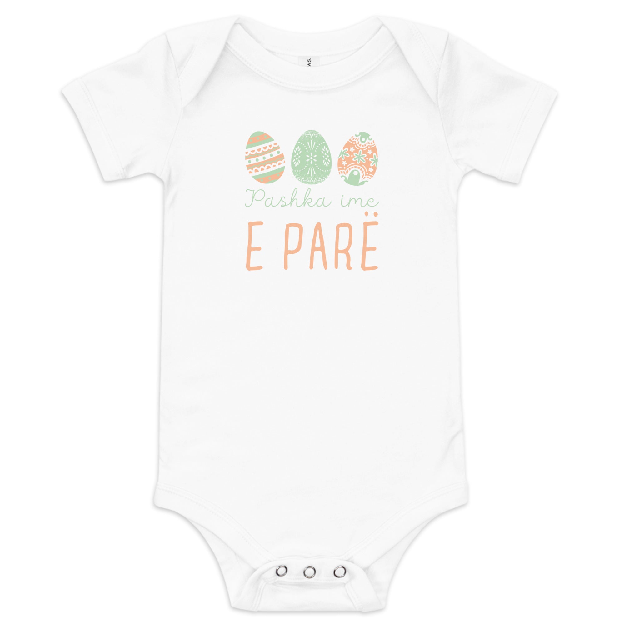 Albanian baby bodysuit with pastel Easter eggs and the phrase “Pashka ime e parë” meaning My First Easter in Albanian