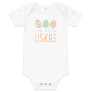 Baby bodysuit with pastel Easter eggs and the phrase “Moj Prvi Uskrs” meaning My First Easter in Serbian, Croatian and Bosnian