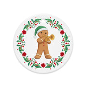 Balkan gingerbread man ornament playing trumpet with floral Balkan Christmas wreath.