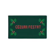 Albanian “Gëzuar Festat” Christmas pillowcase with knitted-style design and holly motifs.