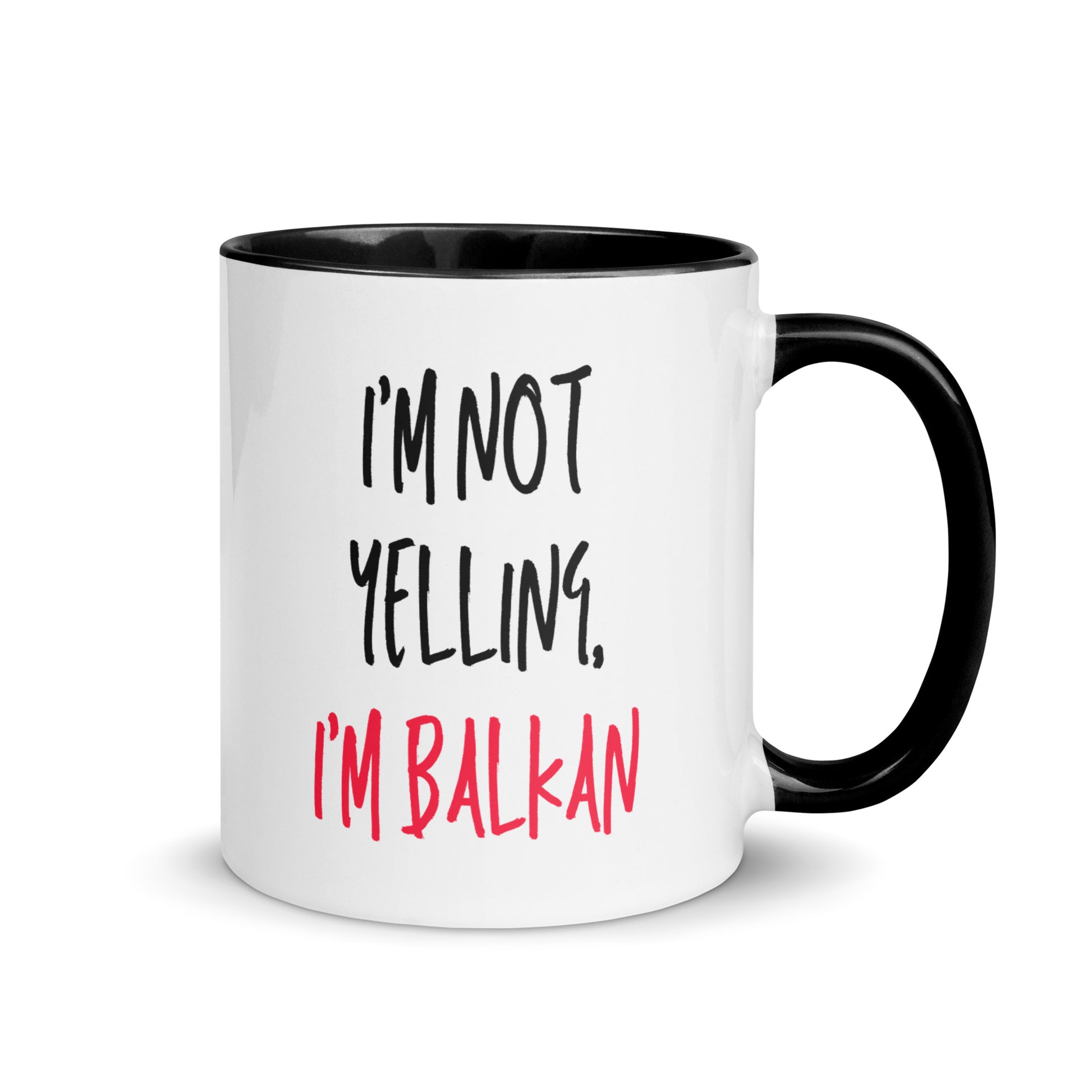 White mug with the text “I’m Not Yelling, I’m Balkan” in black and red lettering.