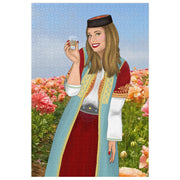 Montenegrin girl in traditional dress surrounded by warm pink flowers, 1000-piece puzzle.