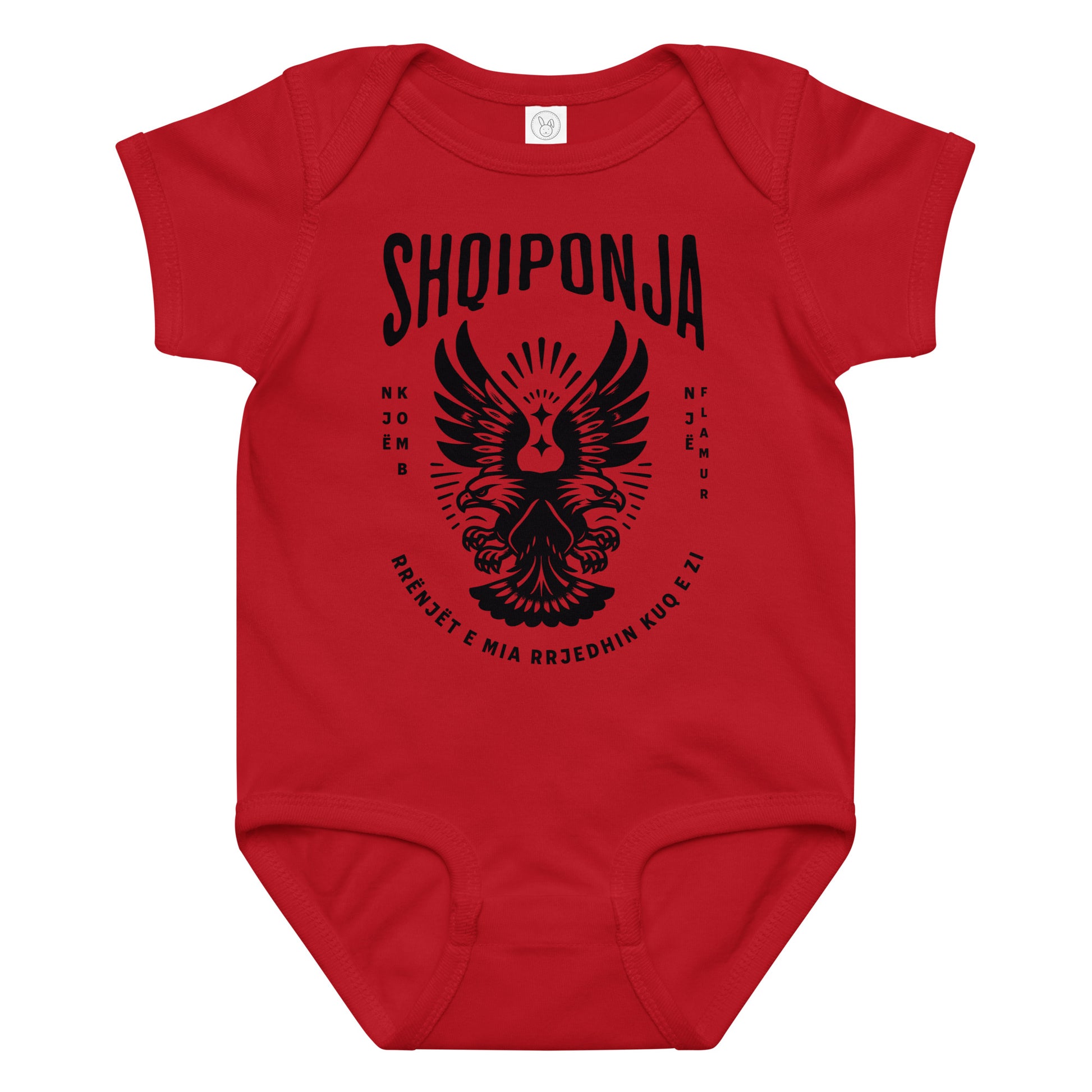 Red and black Albanian eagle baby onesie featuring “Rrënjët e mia rrjedhin kuq e zi.”