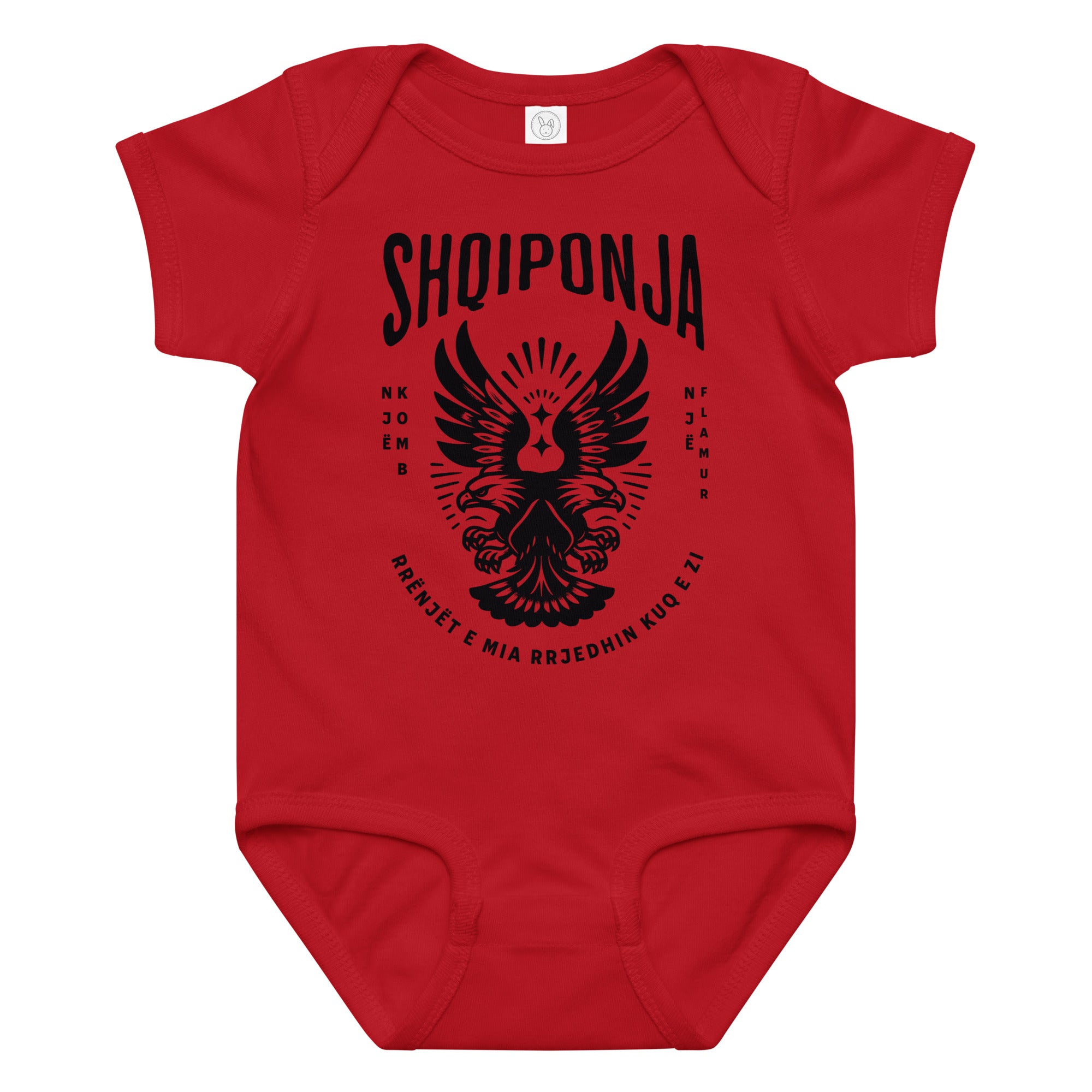 Red and black Albanian eagle baby onesie featuring “Rrënjët e mia rrjedhin kuq e zi.”