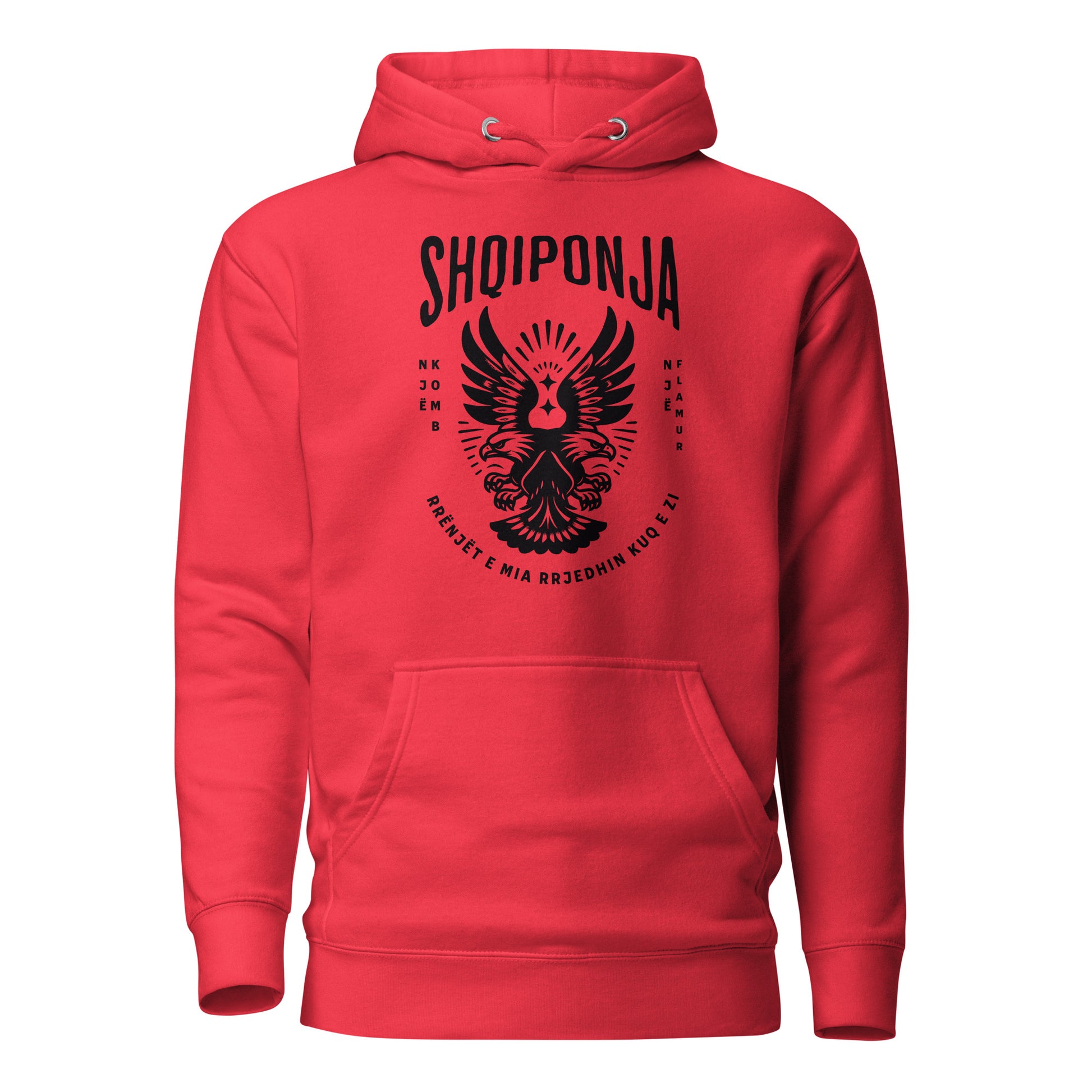 Red hoodie featuring black Albanian double-headed eagle and patriotic phrase “Rrënjët e mia rrjedhin kuq e zi.”