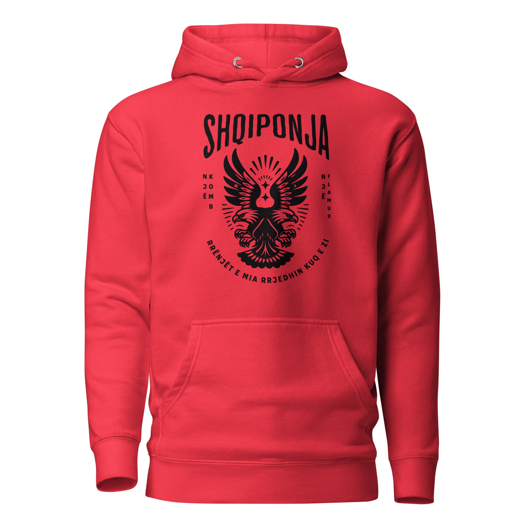 Red hoodie featuring black Albanian double-headed eagle and patriotic phrase “Rrënjët e mia rrjedhin kuq e zi.”