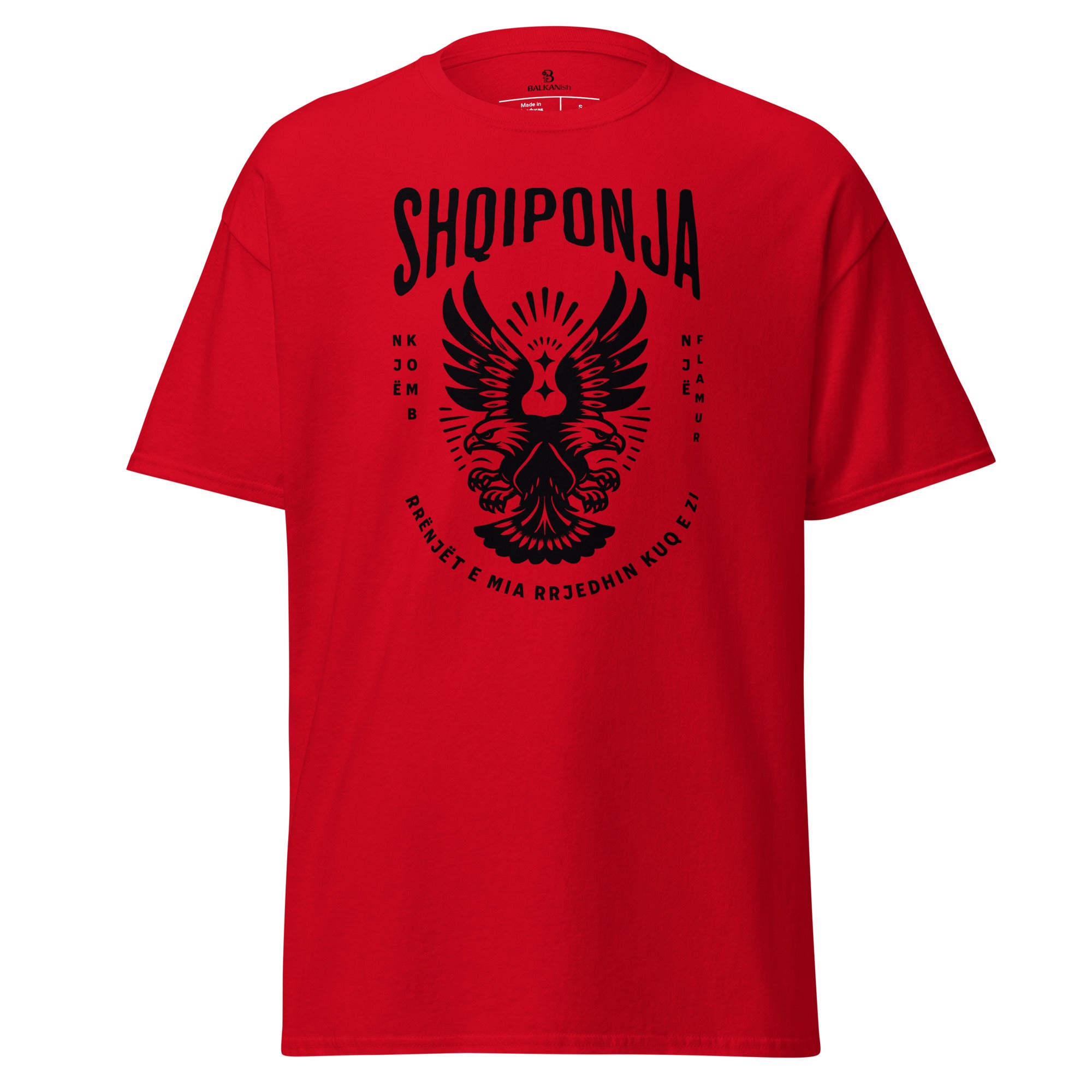 Red and black Albanian eagle shirt with the phrase “Rrënjët e mia rrjedhin kuq e zi.”