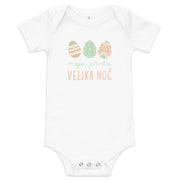 Slovenian baby bodysuit with pastel Easter eggs and the phrase “Moj prvi Velika noč” meaning My First Easter in Slovenian