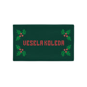 Bulgarian “Vesela Koleda” Christmas pillowcase with holly and knitted-style text.