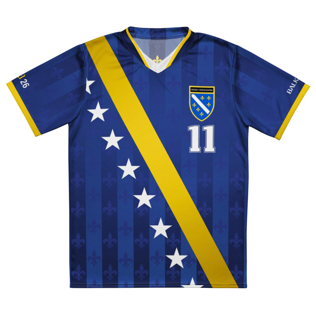 Front view of limited edition Bosnia football jersey featuring Bosna Je Stigla design, blue and gold diagonal stripe, Bosnia-inspired crest, and vintage fleur-de-lis pattern