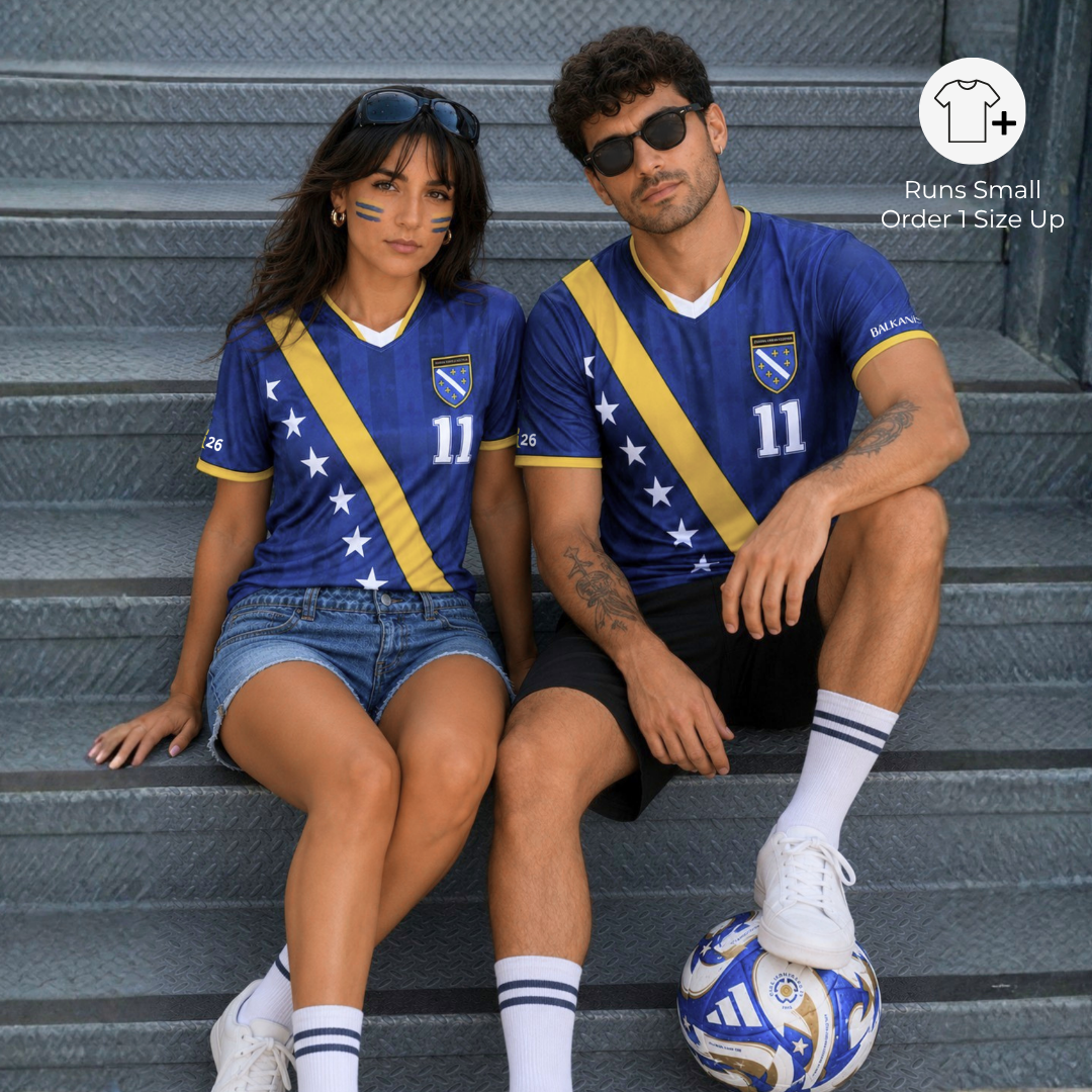 Man and woman wearing matching Bosnia-inspired football jerseys styled as modern Balkan streetwear