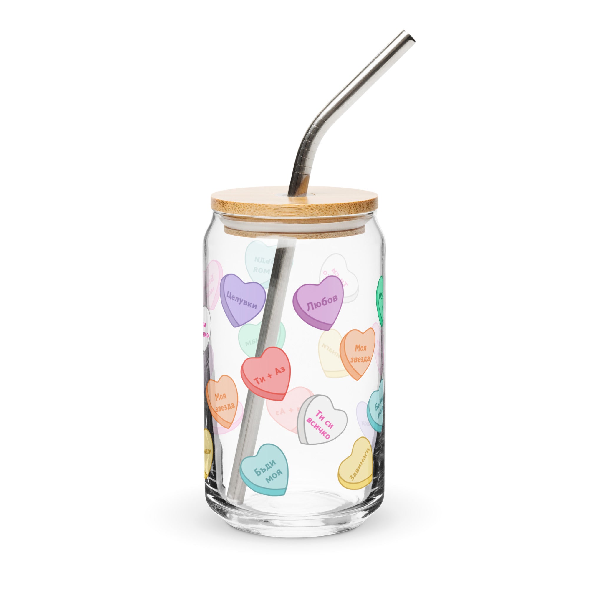 Glass can cup with colorful sweetheart candy hearts and romantic phrases.