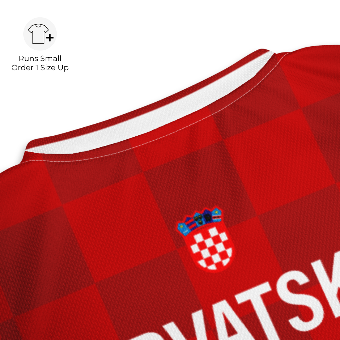 Close-up detail of Croatia-inspired crest and tonal checkered pattern on football jersey back
