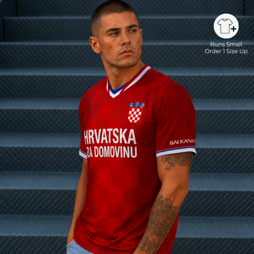 Portrait of man wearing Croatia-inspired football jersey with tonal red checkered pattern and sleeve details