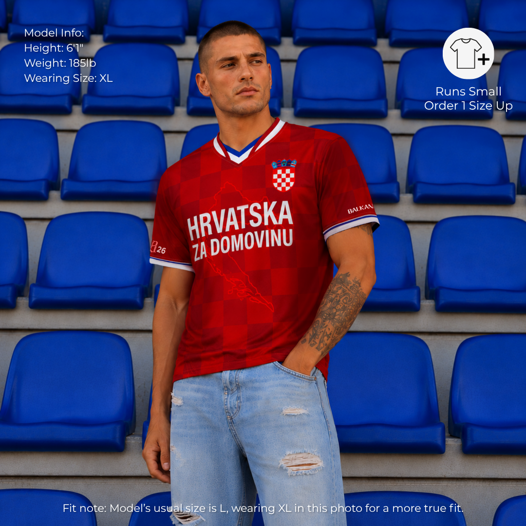 Man wearing Croatia-inspired football jersey in stadium setting with modern Vatreni-inspired styling