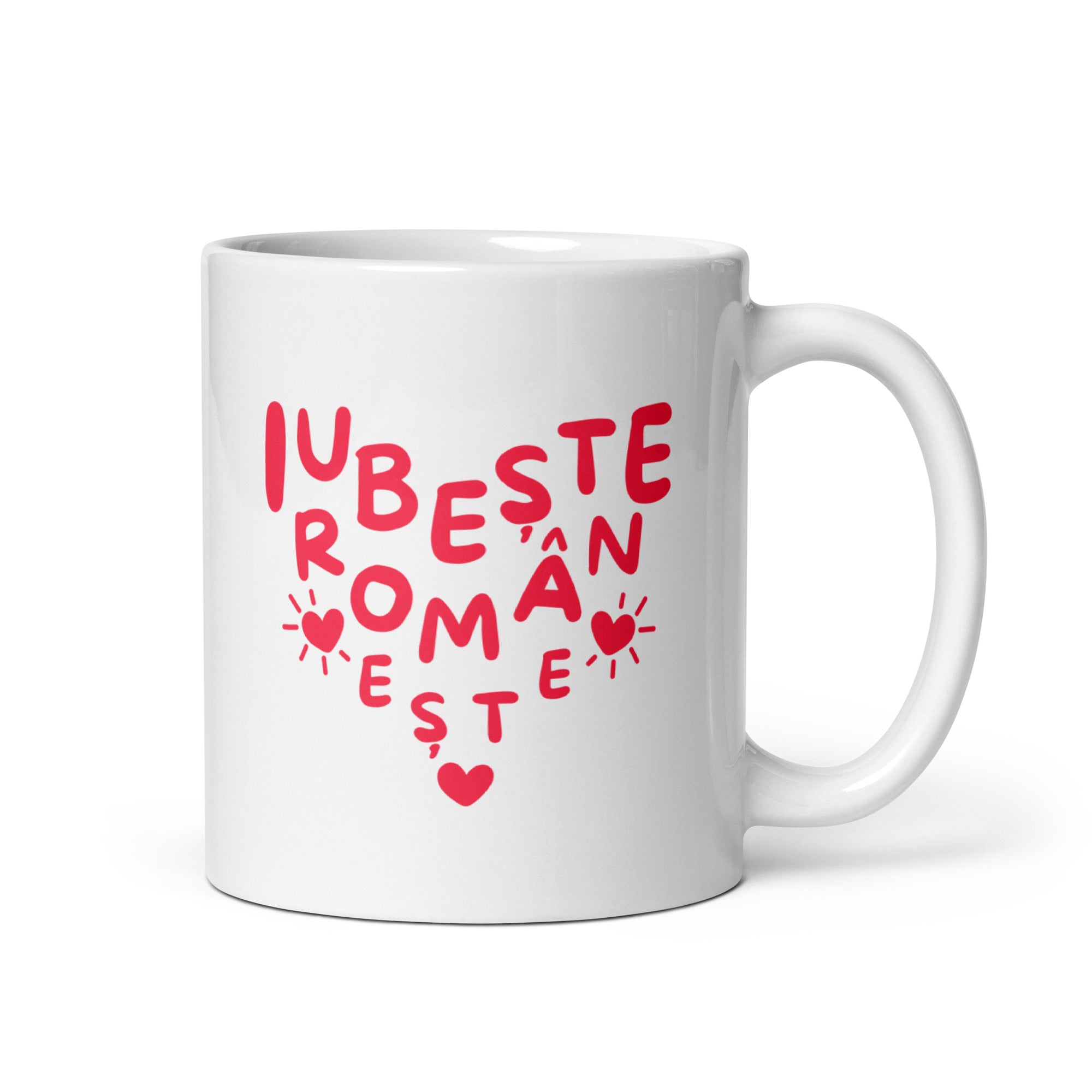 White mug with red lettering forming a heart shape reading “Iubește românește.”