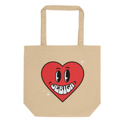 Natural tote bag featuring a red heart character with the word Jebiga
