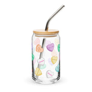 Glass can cup with sweetheart candy heart designs and love phrases.