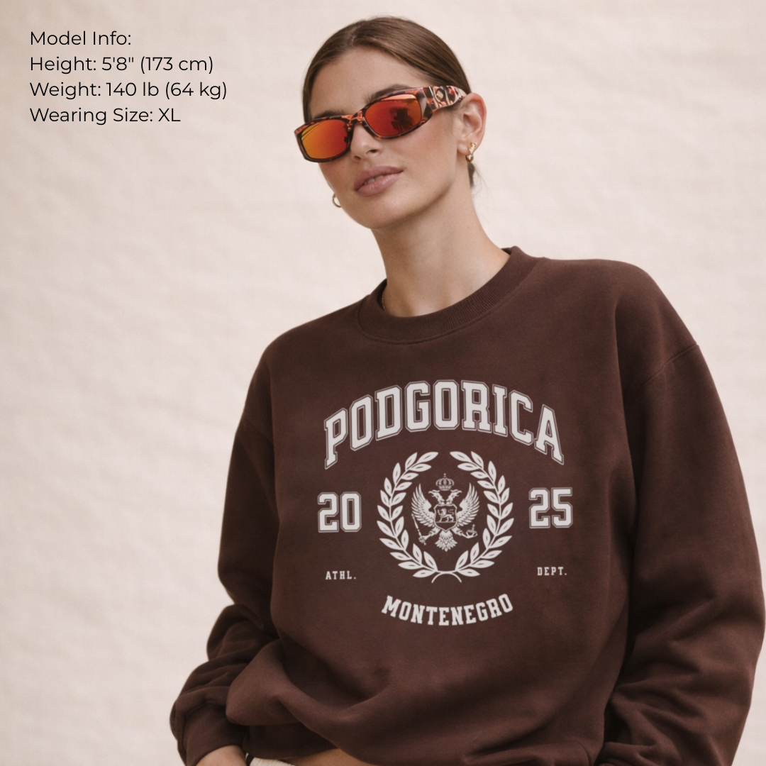 Person wearing a brown sweatshirt with 'Podgorica 2025 Montenegro' text and design.