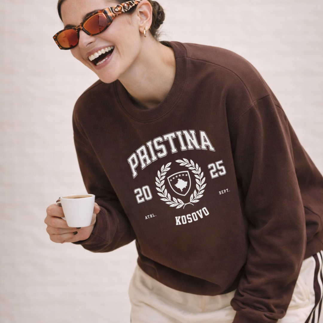 Woman wearing Pristina Kosovo varsity crewneck sweatshirt espresso brown