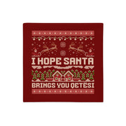 Red Christmas pillowcase with “I Hope Santa Brings You Qetësi” knitted-style text.