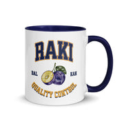 white mug with colored handle featuring raki quality control varsity design and fruit graphic