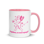White mug with pink handle and interior featuring a cupid illustration and the Romanian phrase “Cupidon, ce mai aștepți?”