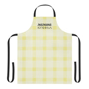 Yellow gingham Balkan apron with the phrase “Мамина Кухиња” written in Serbian Cyrillic.