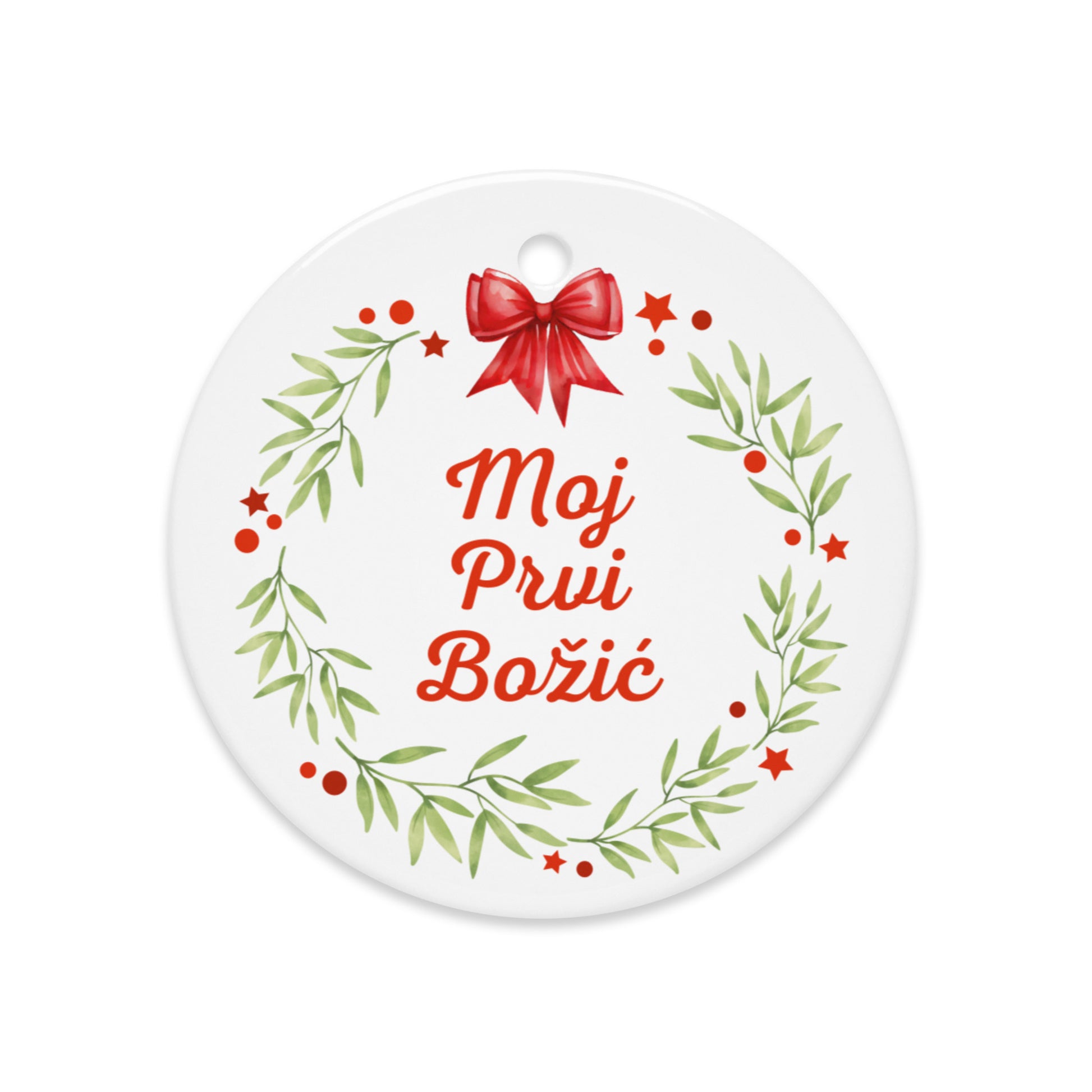 Wreath ornament with red bow and “Moj Prvi Božić”