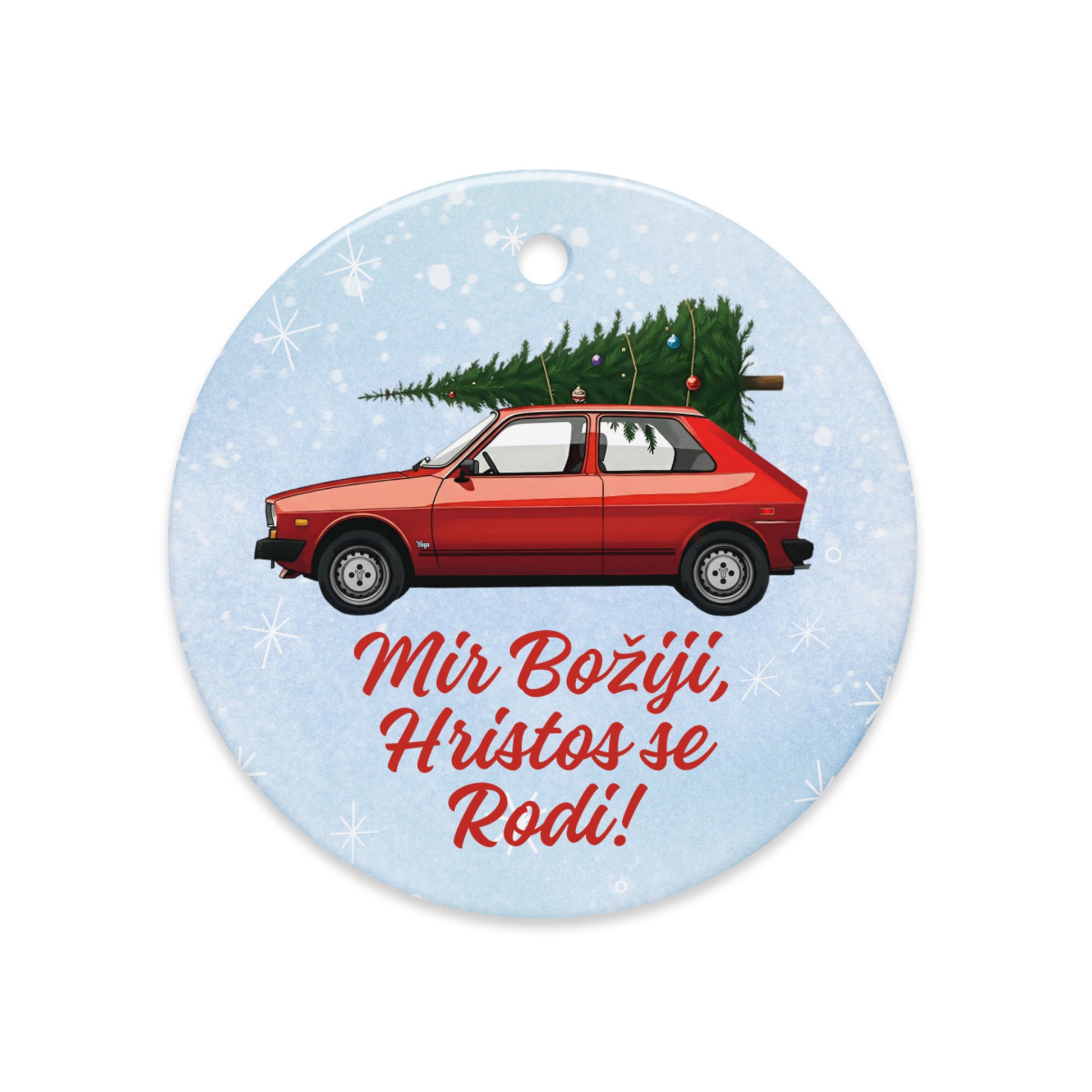 Red Yugo ornament carrying a Christmas tree with “Mir Božiji, Hristos se Rodi!” — Serbian holiday decor