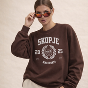 Woman wearing Skopje Macedonia varsity crewneck sweatshirt espresso brown