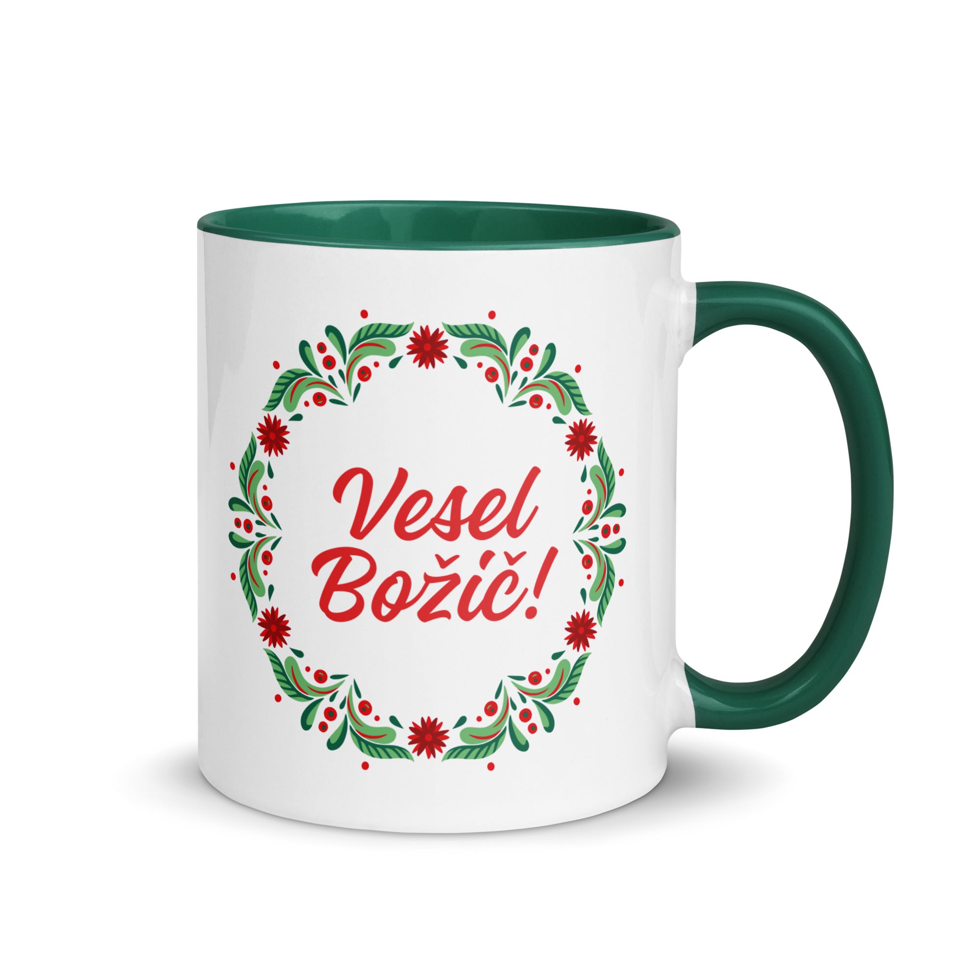 White mug with wreath and “Vesel Božič” Slovenian Christmas text.