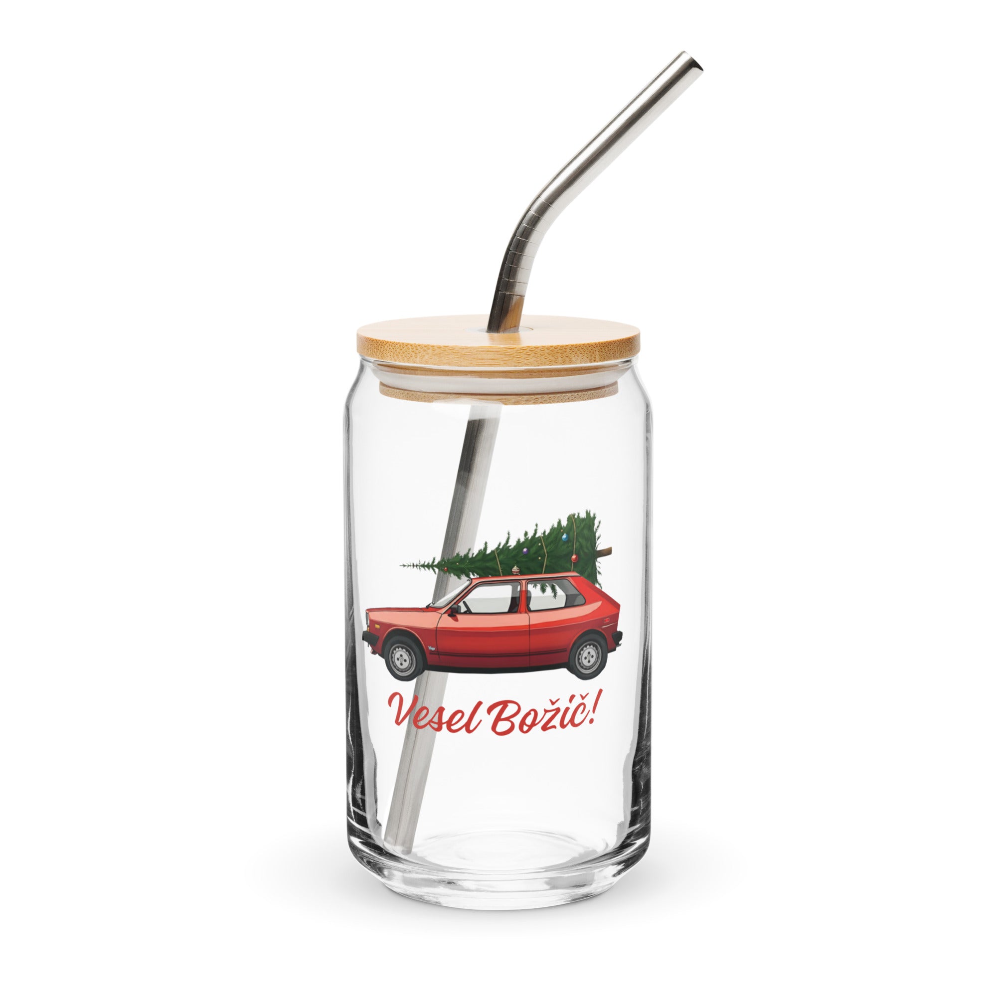 Slovenian Christmas glass with red Yugo carrying a tree and “Vesel Božič” text.Slovenian Christmas glass with red Yugo carrying a tree and “Vesel Božič” text.