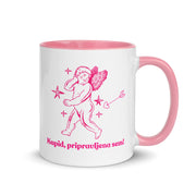 White mug with pink handle and interior featuring a cupid illustration and the Slovenian phrase “Kupid, pripravljena sem!”