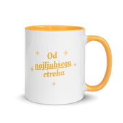 White mug with yellow handle reading “Od najljubšega otroka.”