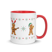 Balkan Gingerbread Band Christmas mug with four gingerbread musicians playing accordion, keyboard, tambura, and trumpet.