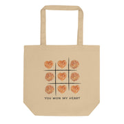 Beige tote bag with heart shaped burek tic tac toe design and text “You Won My Heart”
